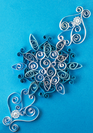 Quilling pattern on a blue backgroundの写真素材