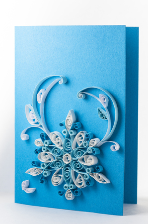 Quilling card with a blue backgroundの写真素材