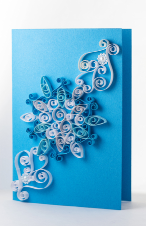 Quilling card with a blue backgroundの写真素材
