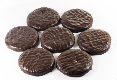 Cookies in chocolate glaze on a white backgroundの写真素材