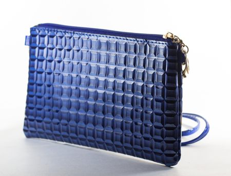 Small female bag of blue color on a white backgroundの写真素材