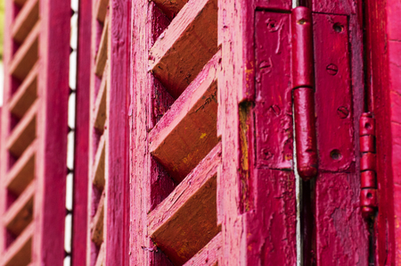 Old wooden shutters in red colorの写真素材