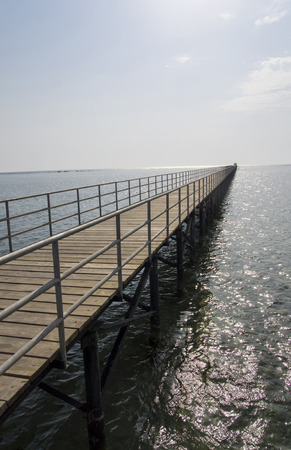 The pier leaving far into the seaの写真素材