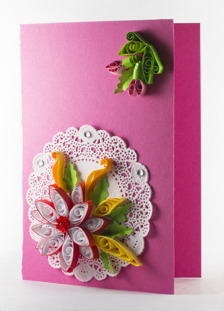 Quilling from paper in the form of a red postcardの写真素材