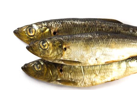 Three smoked fish on a white backgroundの写真素材