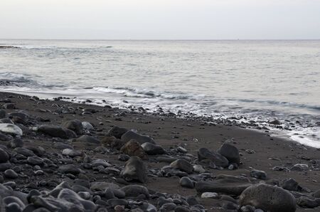 Black lava stones in the surfの写真素材