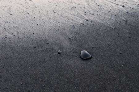 Background of black volcanic sandの写真素材