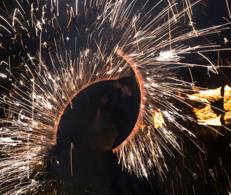 Colorful fire show of lights in the dark, backgroundの写真素材