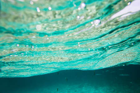 Surface of the sea from under the water, backgroundの写真素材