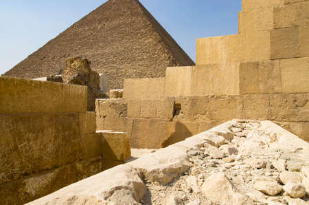 Buildings from blocks against the background of the pyramid in Giza
