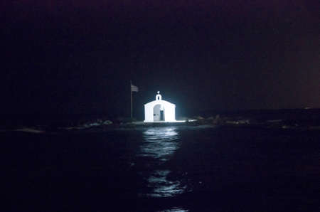 Orthodox chapel on an islet at night, landscapeの写真素材