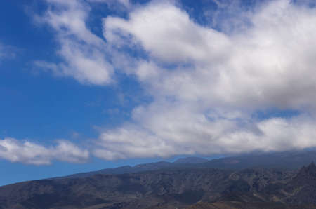 White clouds over the mountainside, landscapeの写真素材