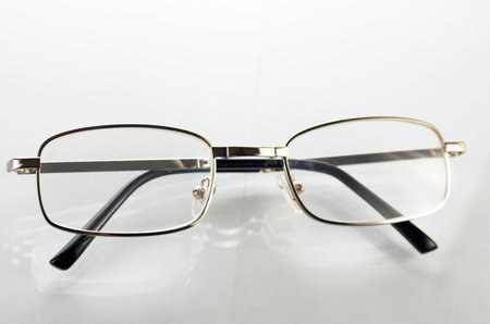 Glasses with metal frames on a white backgroundの写真素材