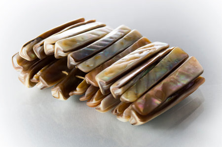 Bracelet made of seashells on a white backgroundの写真素材