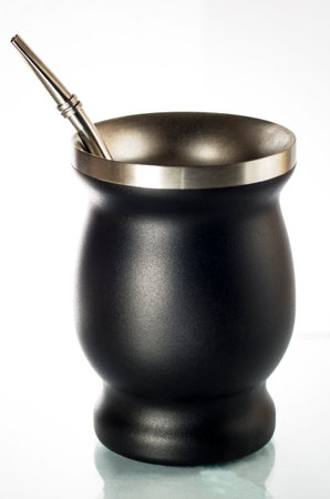 Metal calabash and bombilla on white backgroundの写真素材