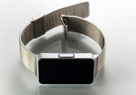 Smart watch with metal bracelet on white backgroundの写真素材