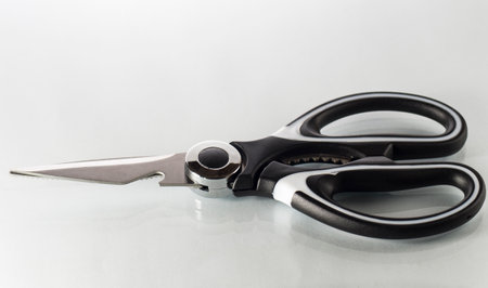 Single kitchen scissors on a white backgroundの写真素材