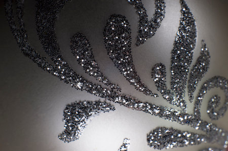 Silver background with sparkles and floral motifの写真素材