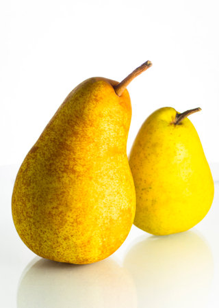 Two ripe yellow pears on a white backgroundの写真素材