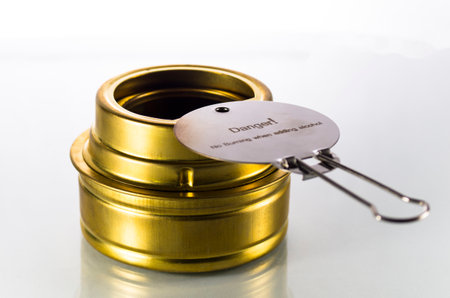 Camping alcohol burner on white backgroundの写真素材