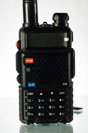 One handheld radio with antenna on white backgroundの写真素材