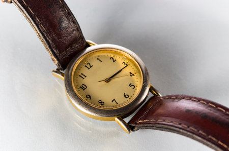 Old wrist watch close-up on a white backgroundの写真素材