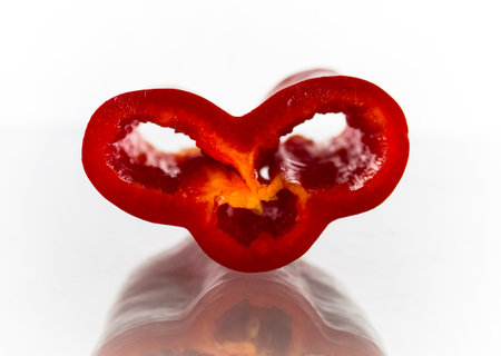 Cut of red bell pepper on white backgroundの写真素材