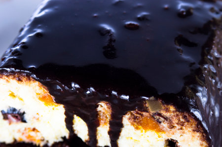Curd cheesecake in chocolate on a plateの写真素材
