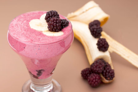  Ð¡ocktail of  banana with frozen  blackberries and  yogurt.の写真素材