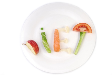 word diet made of vegetables and fruit isolated on whiteの写真素材