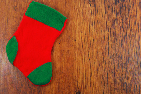 christmas stocking on wooden surface copy space backgroundの写真素材