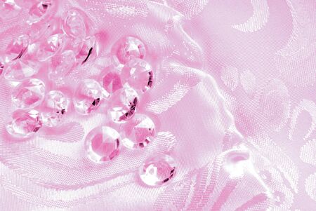pink diamonds on  floral fabricの写真素材