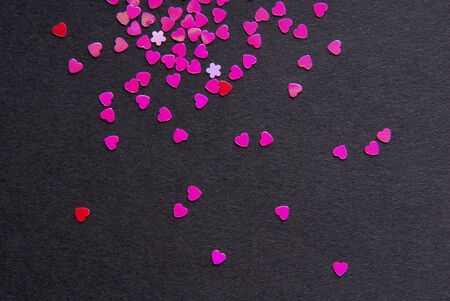 heart shape confetti on blackの写真素材