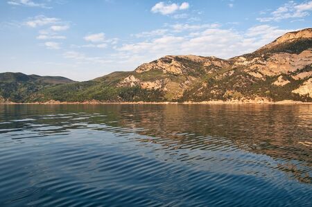 seascape with rocks and the sea surface in calmの写真素材