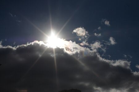 Background. Beautiful Blue Sky With Clouds.Sun behind the clouds.の写真素材