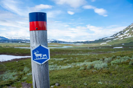 Attention sign pole in National Park for Reindeer belonging to the Indigenous Same people in Northern Scandinavia.の写真素材