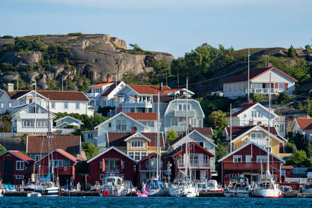 Bovallstrand, Sweden - July 2020: Colorful facades of Swedish summerhouse and sailing boats in harbour in archepelago of West coast Sweden, Bovallstrand by the Sea.のeditorial素材