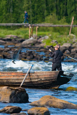 Kukkola, Sweden - July 2019: Fishing in Kukkola River between Sweden And Finland. The fishing...