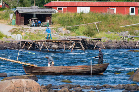 Kukkola, Sweden - July 2019: Fishing in Kukkola River between Sweden And Finland. The fishing technique is a true Scandinavian Craftmanship and a worth while destination to travel to.のeditorial素材