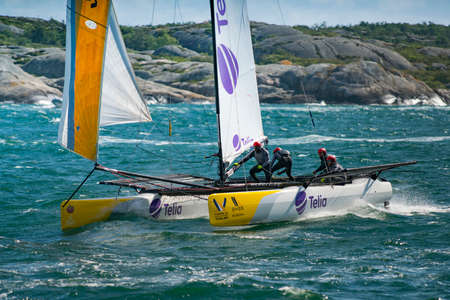 MARSTRAND, SWEDEN - JULI 3, 2019: GKSS Match Cup Sweden - Big Boat Race M32 Catamaran Competition at Marstrand Sweden - One Big Boat Catamaran Sailing Windy condition at Marstrand Race in Sweden.のeditorial素材