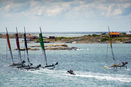 MARSTRAND, SWEDEN - JULI 3, 2019: Strong Wind Boat Race for Men and Woman compete for Trophy. Big Boat Race M32 Catamaran Competition at Marstrand Sweden. Windy condition at Marstrand Race in Sweden.のeditorial素材