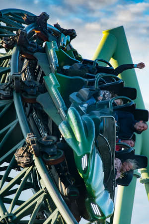 GOTHENBURG, SWEDEN - JULY 8, 2019: People screaming and holding up hands during roller coaster ride Helix at Liseberg amusement park Gothenburg Sweden - People having fun at their leisure.のeditorial素材