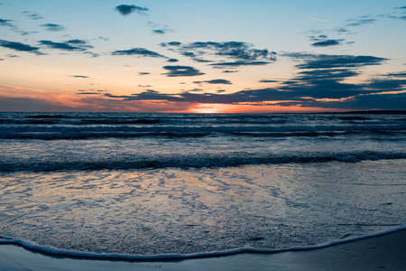 Wide angle Beautiful Setting sun at beach Tylosand Halmstad, one of Swedens most popular beaches.の写真素材
