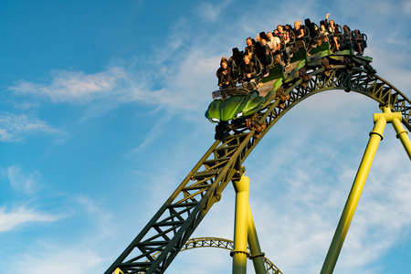 GOTHENBURG, SWEDEN - JULY 8, 2019: People screaming and holding up hands during roller coaster ride Helix at Liseberg amusement park Gothenburg Sweden - People having fun at their leisure.のeditorial素材