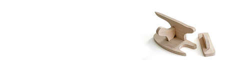 A wooden block made of beech for ironing with an iron. A tool for a tailor.の写真素材