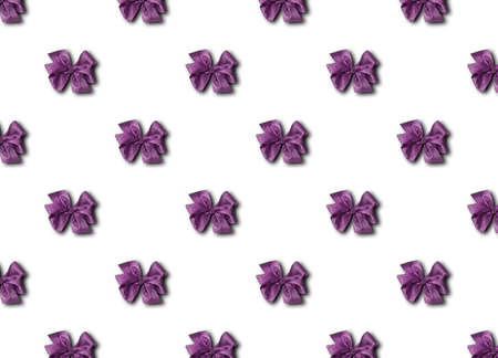 Purple bow for decorating gifts on a white background. Beautifully tied bow. Photo of a gift package...