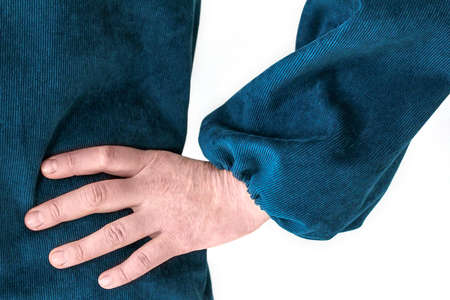 A white young woman stands confidently with her hand in her waist pocket. She is wearing a corduroy dress. Scope of application: clothing brand, self-tailoring, atelier, fashion design, clothing itemsの写真素材