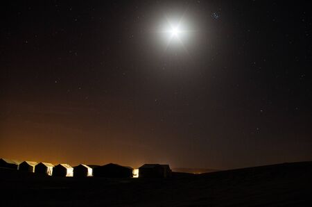 Nomad camp in the desert at nightの写真素材