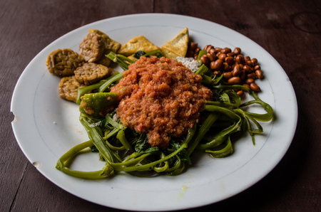 Indonesian dish kankung plecing (spicy water spinach dish) typical for Lombok island.の写真素材