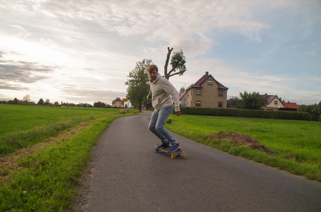 Longboarder going down the hill.の写真素材